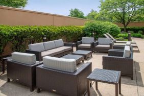 Sonesta Select Allentown Bethlehem Airport’s terrace has coffee tables, armchairs, and sofa seating.