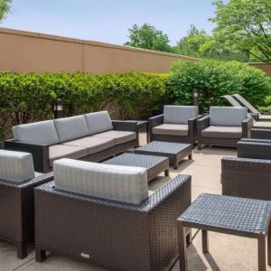 Sonesta Select Allentown Bethlehem Airport’s terrace has coffee tables, armchairs, and sofa seating.