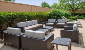 Sonesta Select Allentown Bethlehem Airport’s terrace has coffee tables, armchairs, and sofa seating.