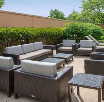 Sonesta Select Allentown Bethlehem Airport’s terrace has coffee tables, armchairs, and sofa seating.