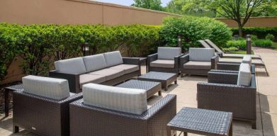 Sonesta Select Allentown Bethlehem Airport’s terrace has coffee tables, armchairs, and sofa seating.