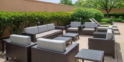 Sonesta Select Allentown Bethlehem Airport’s terrace has coffee tables, armchairs, and sofa seating.