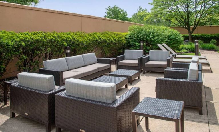 Sonesta Select Allentown Bethlehem Airport’s terrace has coffee tables, armchairs, and sofa seating.