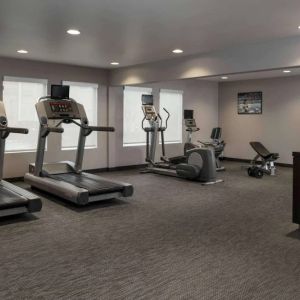 The hotel fitness center has an assortment of exercise machines and free weights.