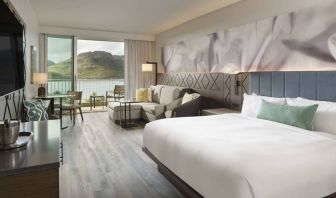 Royal Sonesta Kaua'i Resort Lihue double bed guest room, with sofa, balcony, and an ocean view.