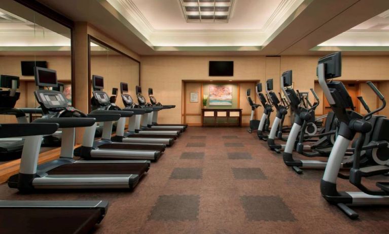 Royal Sonesta Kaua'i Resort Lihue’s fitness center has a large number of exercise machines and a wall-mounted widescreen television.