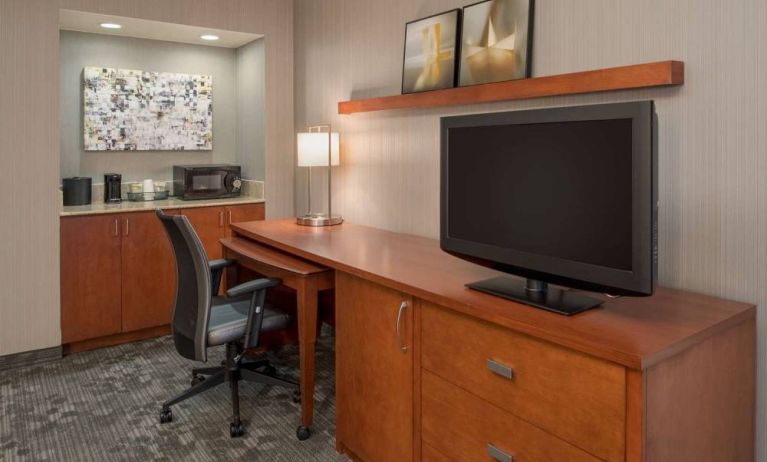 Sonesta Select Seattle Bellevue Redmond guest room workspace, featuring desk and chair, plus TV.