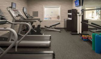 Free weights and various exercise machines are available in the hotel fitness center.