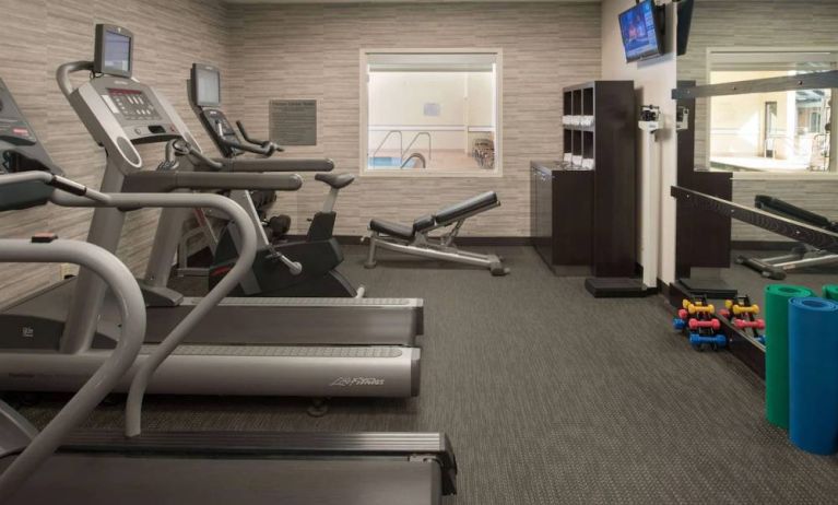 Free weights and various exercise machines are available in the hotel fitness center.