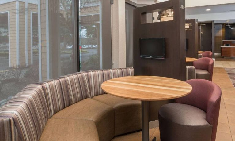 The hotel’s media pods offer a cozy setting for socializing or work, and each has a coffee table and TV.