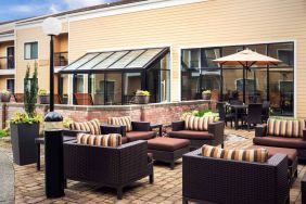 Sonesta Select Seattle Bellevue Redmond’s terrace is decorated with plants and provides armchairs and coffee tables.