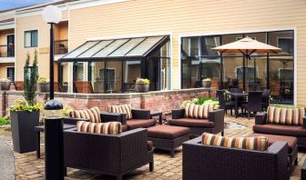 Sonesta Select Seattle Bellevue Redmond’s terrace is decorated with plants and provides armchairs and coffee tables.