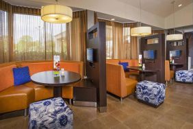 The hotel’s meeting pods provide comfortable seating with televisions and coffee tables for guests to socialize and work.