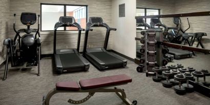 The hotel’s fitness center has treadmills, an elliptical machine, bench, and assorted free weights.