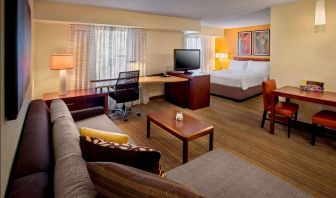 Sonesta ES Suites Allentown Bethlehem Airport double bed guest room, featuring workspace desk and chair, plus sofa and TV.