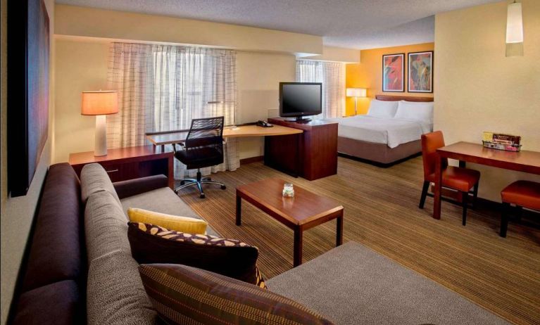 Sonesta ES Suites Allentown Bethlehem Airport double bed guest room, featuring workspace desk and chair, plus sofa and TV.