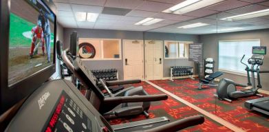 Sonesta ES Suites Allentown Bethlehem Airport’s fitness center has a variety of exercise machines in addition to rows of free weights.