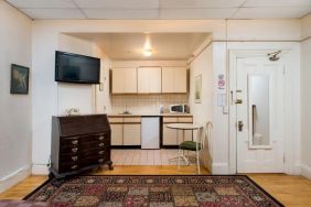 Day use room with TV and kitchenette at The Farrington Inn.