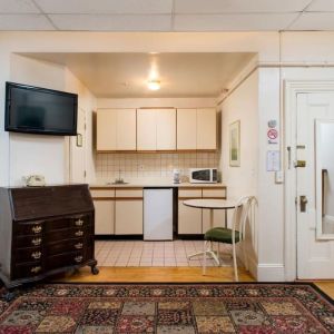 Day use room with TV and kitchenette at The Farrington Inn.