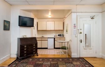 Day use room with TV and kitchenette at The Farrington Inn.