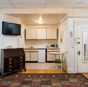 Day use room with TV and kitchenette at The Farrington Inn.