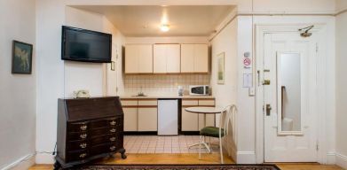 Day use room with TV and kitchenette at The Farrington Inn.