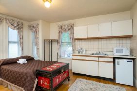 Day use room with natural like and small kitchen area at The Farrington Inn.