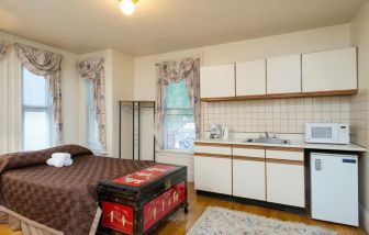 Day use room with natural like and small kitchen area at The Farrington Inn.