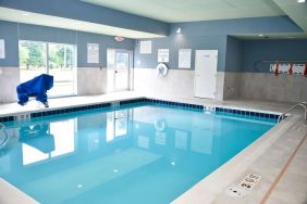 Indoor pool with chairs at Holiday Inn Express & Suites Bensenville - O'Hare.