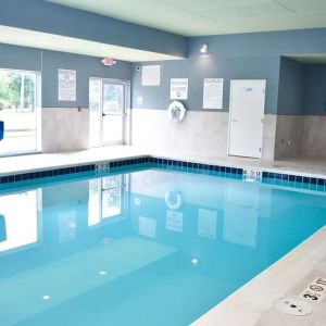 Indoor pool with chairs at Holiday Inn Express & Suites Bensenville - O'Hare.