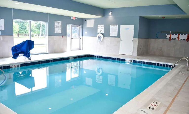 Indoor pool with chairs at Holiday Inn Express & Suites Bensenville - O'Hare.