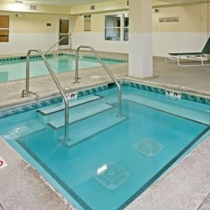 Relaxing indoor pool area at Country Inn & Suites By Radisson, Chicago O'Hare South.