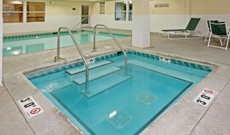 Relaxing indoor pool area at Country Inn & Suites By Radisson, Chicago O'Hare South.