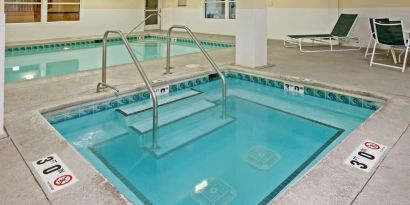 Relaxing indoor pool area at Country Inn & Suites By Radisson, Chicago O'Hare South.