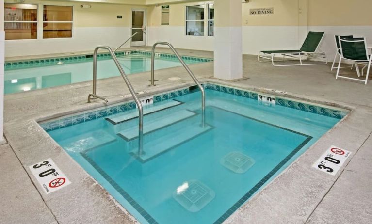 Relaxing indoor pool area at Country Inn & Suites By Radisson, Chicago O'Hare South.