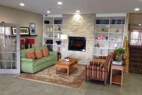 Lounge and coworking space at Country Inn & Suites By Radisson, Chicago O'Hare South.