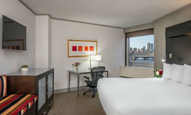 Royal Sonesta Boston double bed guest room, including workspace desk and chair, plus television.