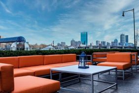 Royal Sonesta Boston’s patio provides comfortable outdoor seating and large coffee tables.