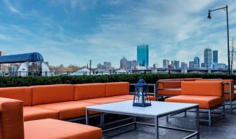 Royal Sonesta Boston’s patio provides comfortable outdoor seating and large coffee tables.