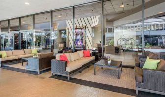 Sonesta Los Angeles Airport LAX’s lobby lounge features comfy sofa and armchair seating, and large coffee tables.