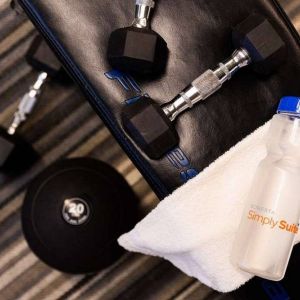 Sonesta Simply Suites Dallas Galleria’s fitness center includes a range of free weights for guests to use (including on a bench).