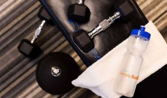 Sonesta Simply Suites Dallas Galleria’s fitness center includes a range of free weights for guests to use (including on a bench).