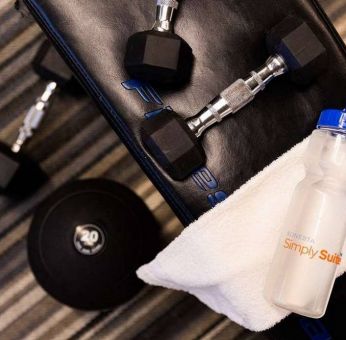 Sonesta Simply Suites Dallas Galleria’s fitness center includes a range of free weights for guests to use (including on a bench).