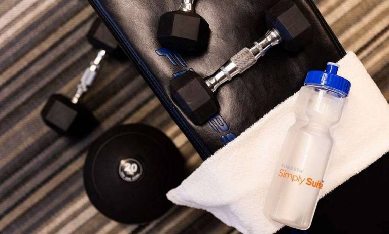 Sonesta Simply Suites Dallas Galleria’s fitness center includes a range of free weights for guests to use (including on a bench).