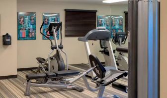 Sonesta Simply Suites Pittsburgh Airport’s fitness center is equipped with an assortment of exercise machines and a bench for those using weights.