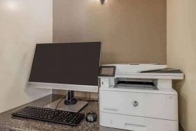 The hotel business center includes monitor, keyboard, and mouse, plus a printer.