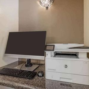 The hotel business center includes monitor, keyboard, and mouse, plus a printer.