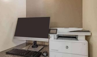 The hotel business center includes monitor, keyboard, and mouse, plus a printer.