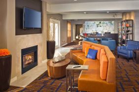 The hotel’s lobby lounge features a fireplace and widescreen TV, plus comfortable seating and coffee tables.