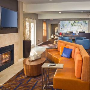 The hotel’s lobby lounge features a fireplace and widescreen TV, plus comfortable seating and coffee tables.